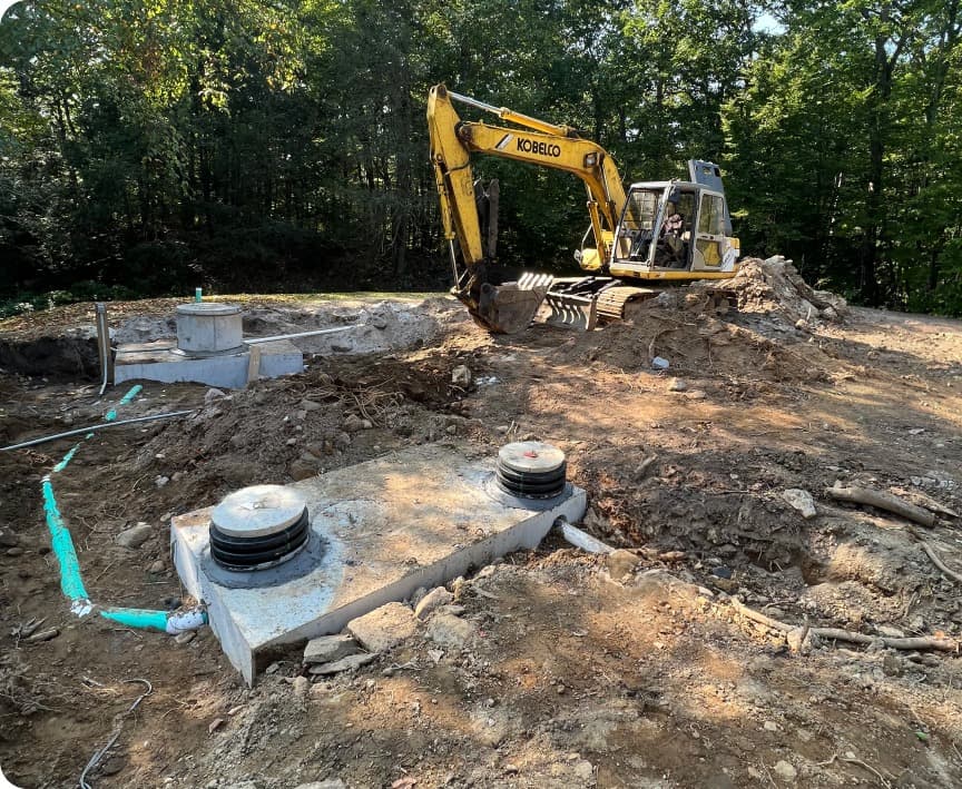 Excavator performing septic work